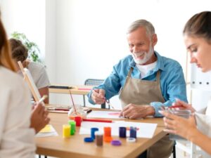 Premier Homecare Services Blog/Articles Seniors stretching together outdoors in a park, showing how engaging activities for elderly people can include gentle movement and fresh air.